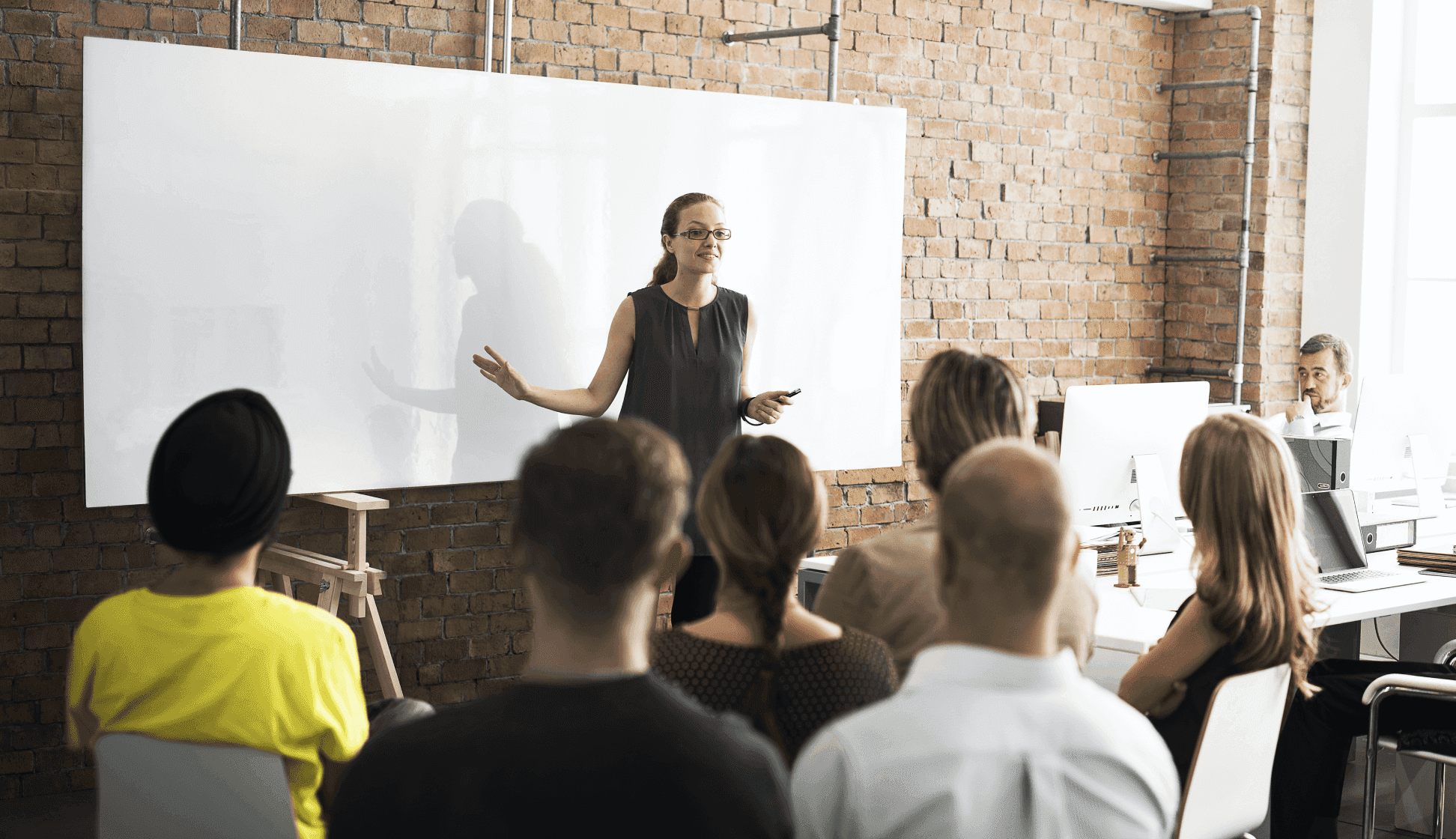 Girl talking to a group of people